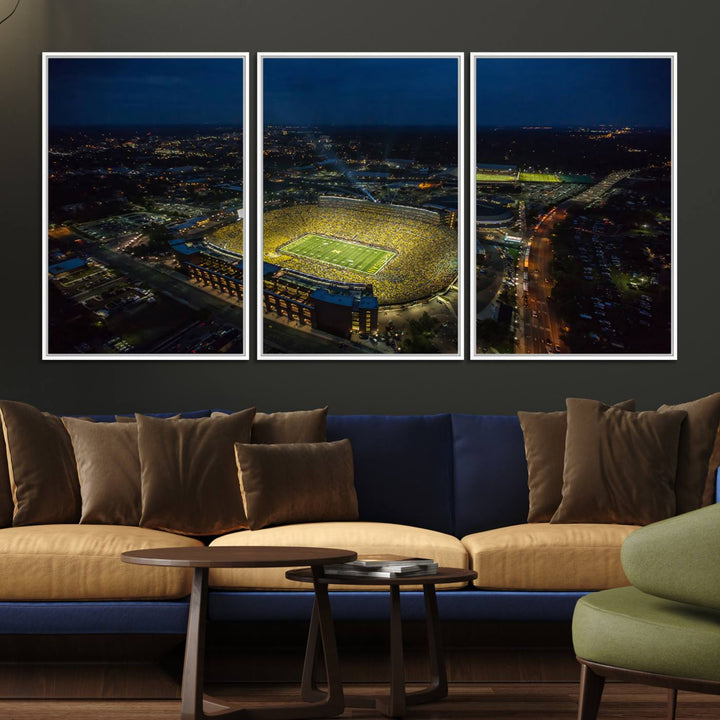 Aerial view of Michigan Stadium at night, surrounded by city lights, depicted on a Michigan Wolverines wall art canvas print.