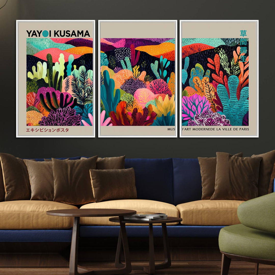 The framed Yayoi Kusama wall art adds vibrancy above the blue couch.