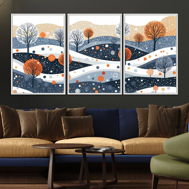 The "Abstract Winter Landscape Canvas Wall Art Print," featuring a triptych of landscapes with trees and hills in vibrant orange, white, and blue hues, adds a gallery-quality finish that transforms the space into an art lover's dream.