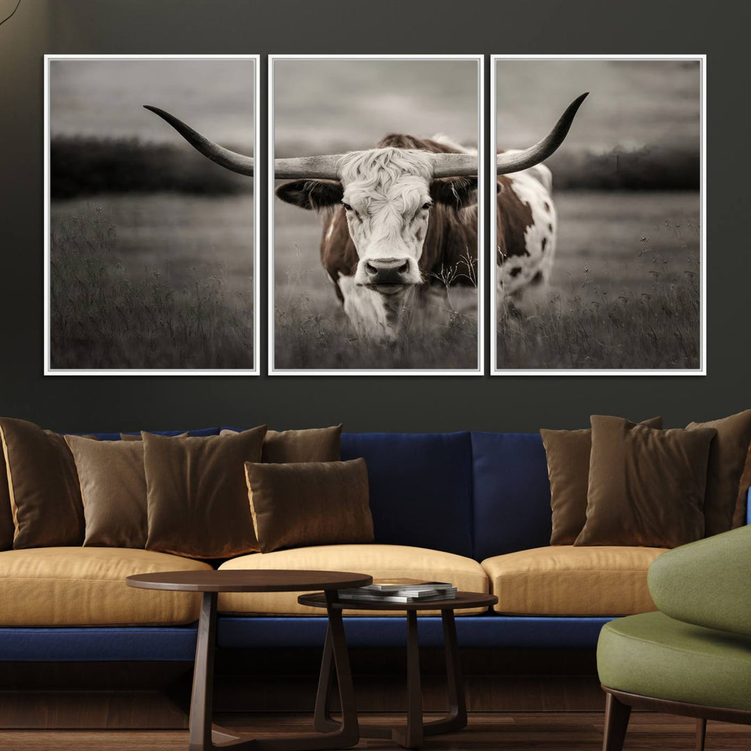 The Texas Longhorn Cow Canvas Wall Art Print adds a rustic touch to a living room.