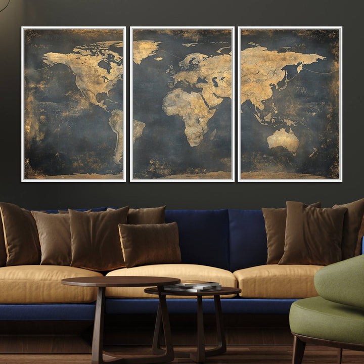 The Grunge World Map Canvas Wall Art features golden tones and is displayed against a white-paneled wall.