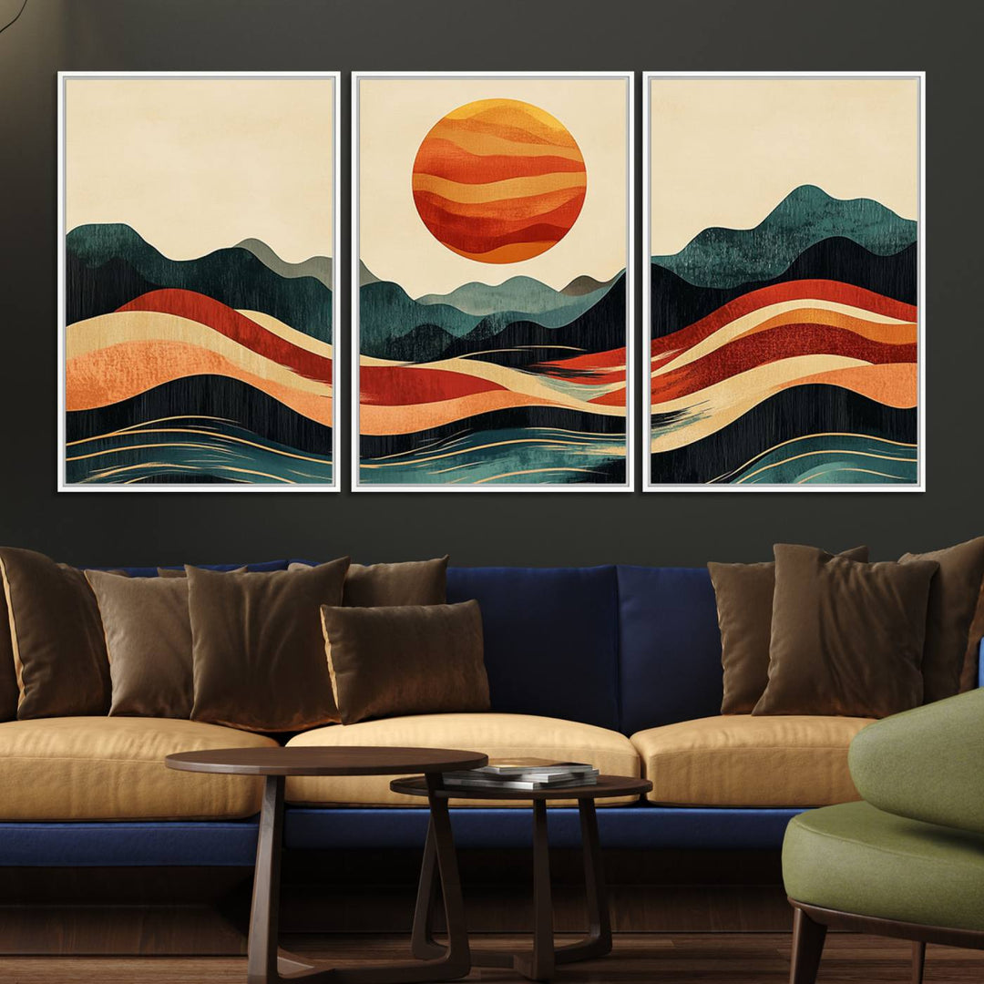 The Mountain Triptych wall art, featuring a design of the sun, mountains, and waves, is displayed prominently on the wall.