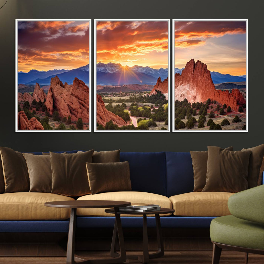 A vibrant sunset over the Rocky Mountains with red rocks.