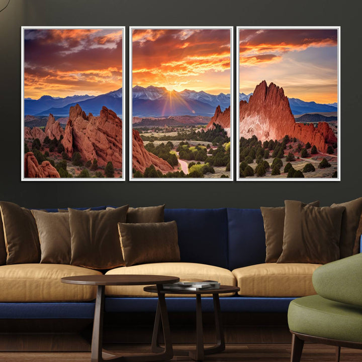 A vibrant sunset over the Rocky Mountains with red rocks.