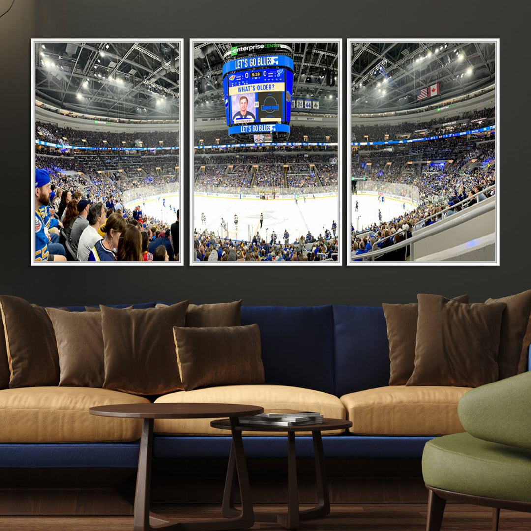 Wall art prints depicting the bustling scenes of the St. Louis Blues being cheered on by a full house at the Enterprise Center, beneath a large scoreboard.