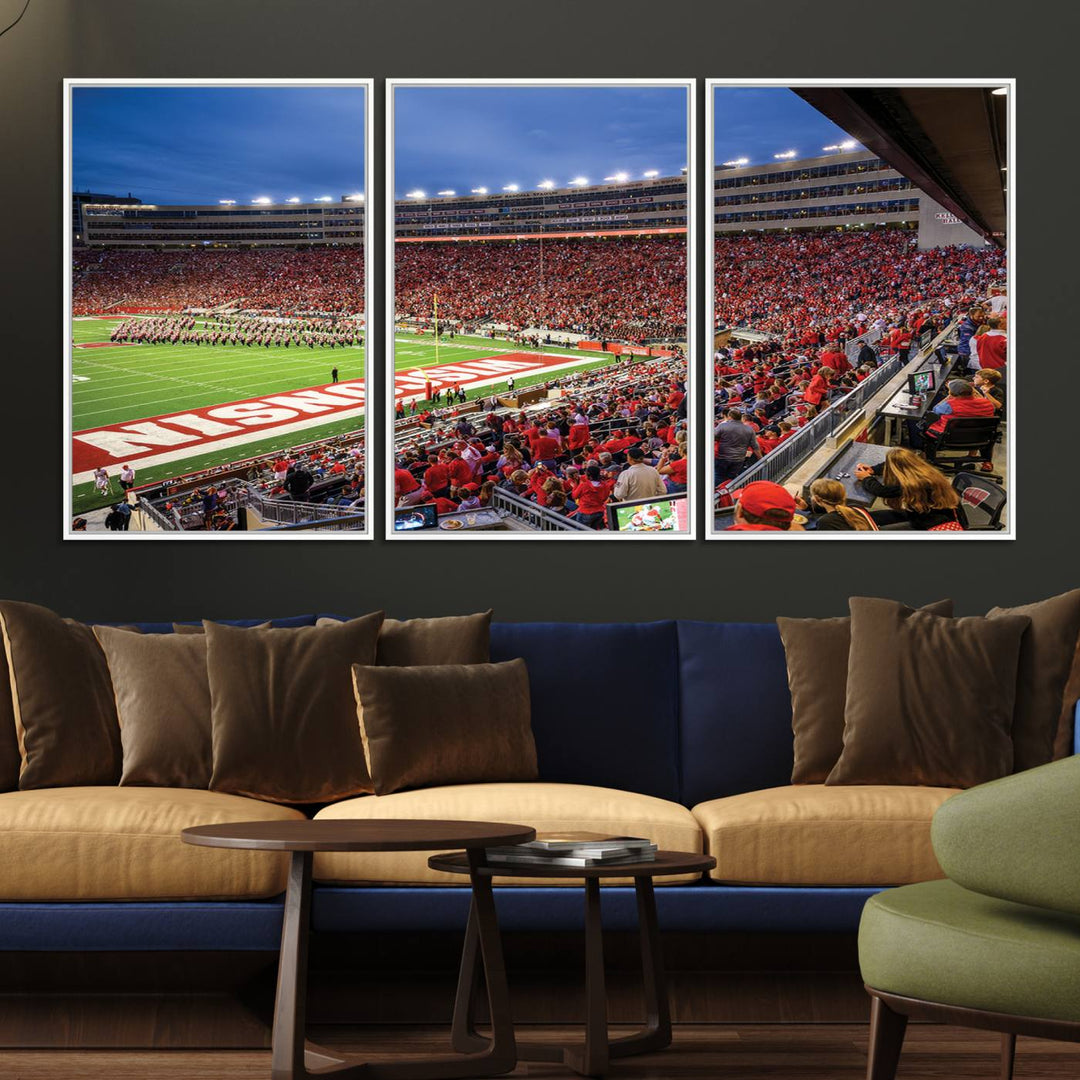 A vibrant wall art captures the essence of Madison Camp Randall Stadium, depicting a sea of fans in red and white during a Wisconsin Badgers football game under bright lights.