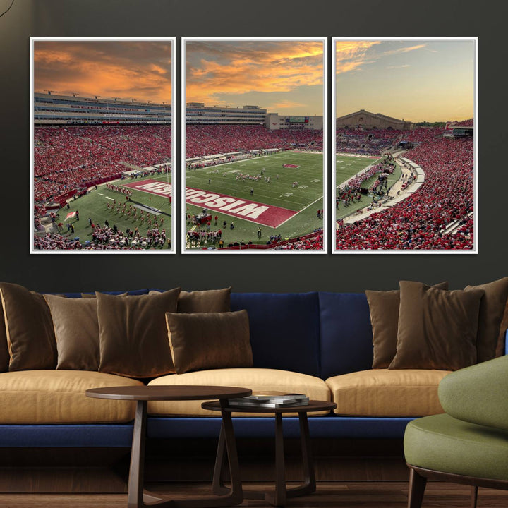 The wall features a Wisconsin Badgers wall art canvas print, capturing the vibrant atmosphere of a full Camp Randall Stadium at sunset.