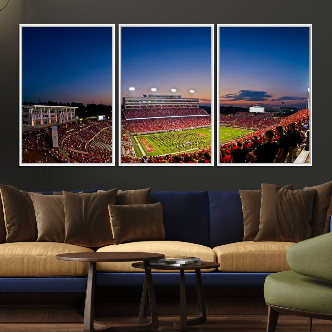 The Wolfpack Football Team Print captures a band and crowd at dusk in a premium canvas art style at Raleigh Carter-Finley Stadium.