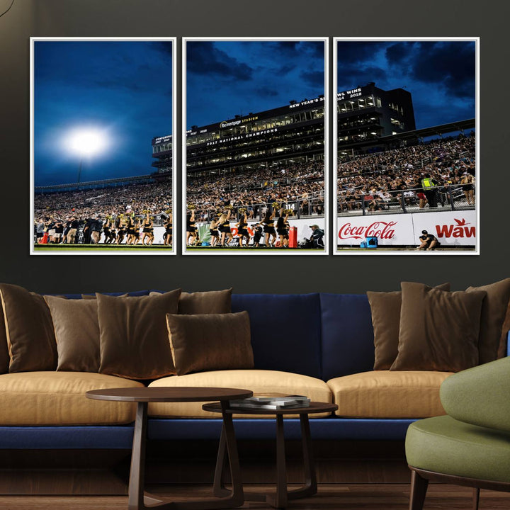 A gallery-quality canvas print depicting a stadium packed with fans under a night sky, highlighting the UCF Knights Football Team.