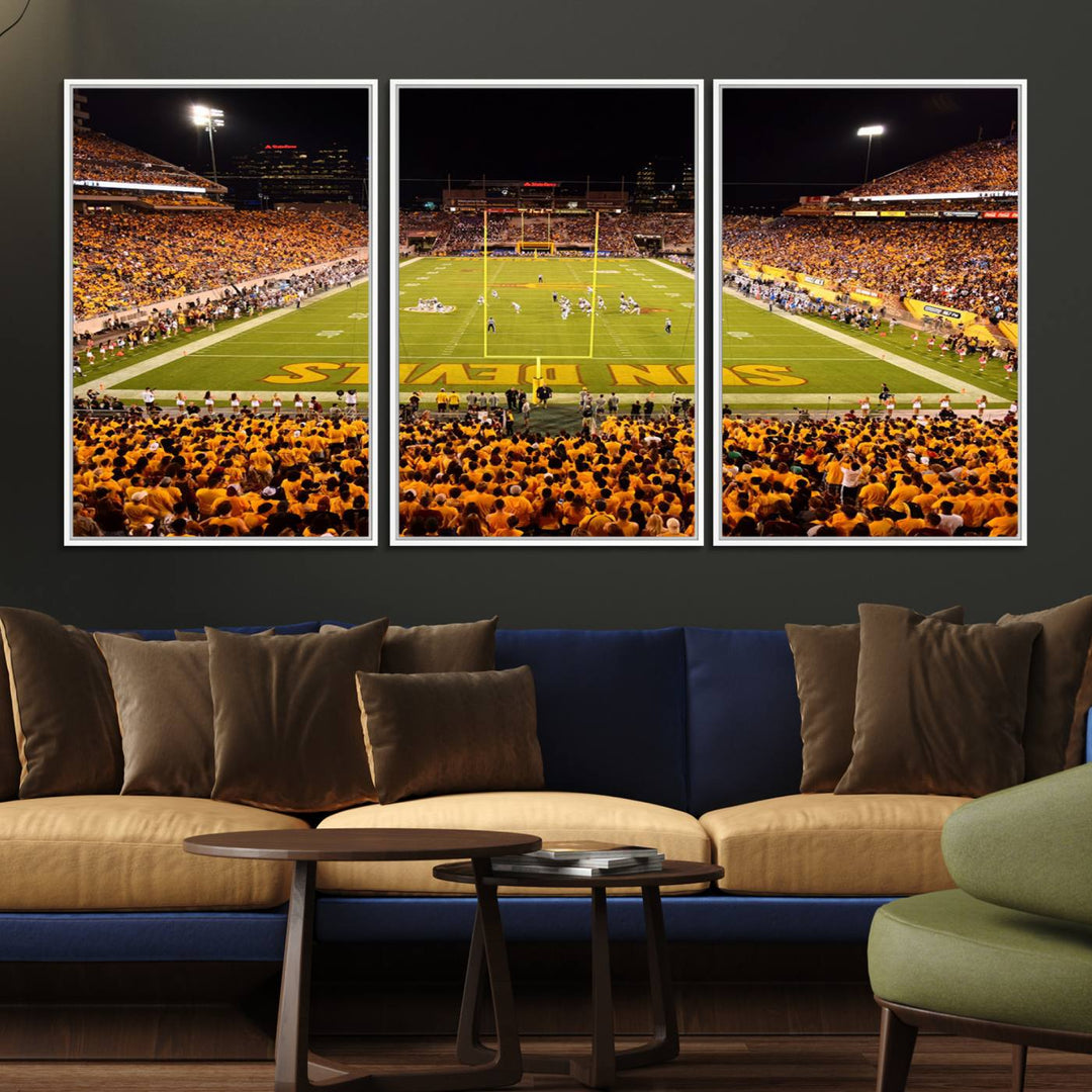 The Phoenix Stadium Canvas Wall Art features a vibrant depiction of a packed stadium filled with ASU Sun Devils fans wearing yellow shirts.