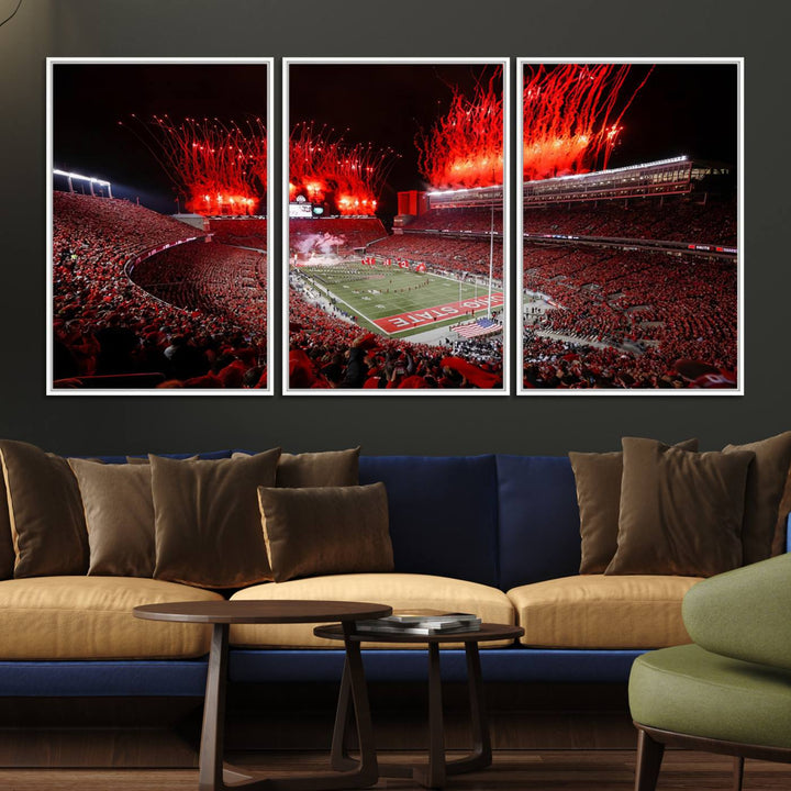 A vibrant red canvas art of a packed Ohio State Buckeyes stadium at night with fireworks.