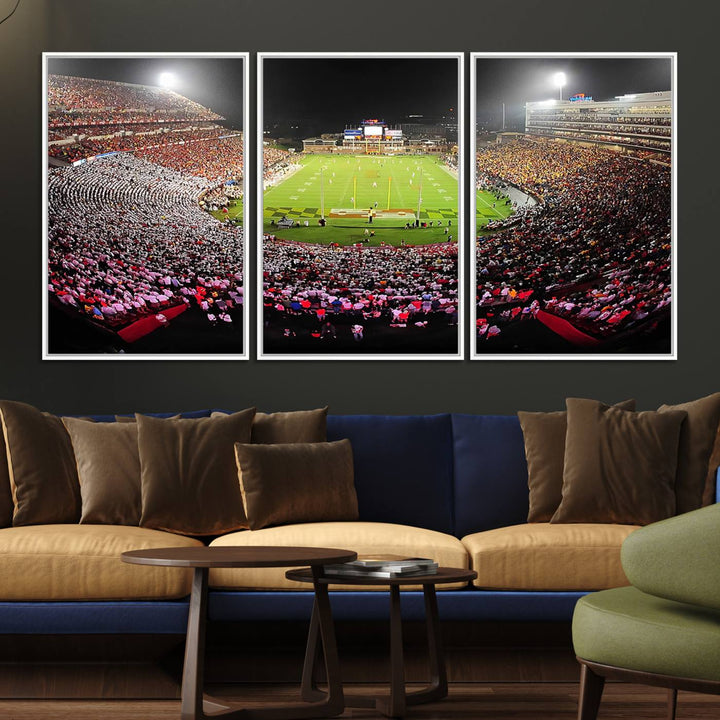 The Maryland Terrapins Football Wall Art Canvas showcases a packed SECU Stadium at night with a bright field and cheering fans.