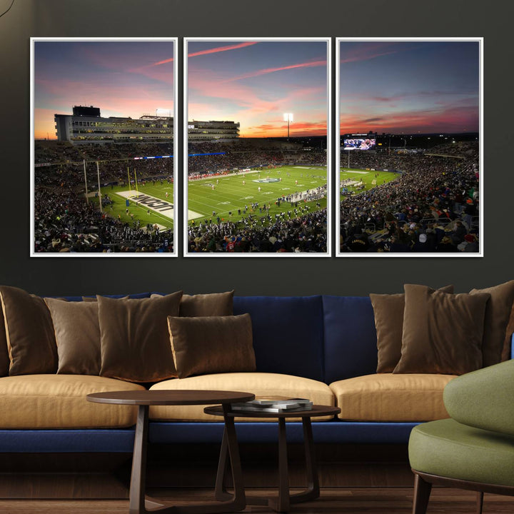 This wall art canvas print captures UCONN Huskies fans energizing a sunset scene at East Hartfords Pratt & Whitney Stadium.