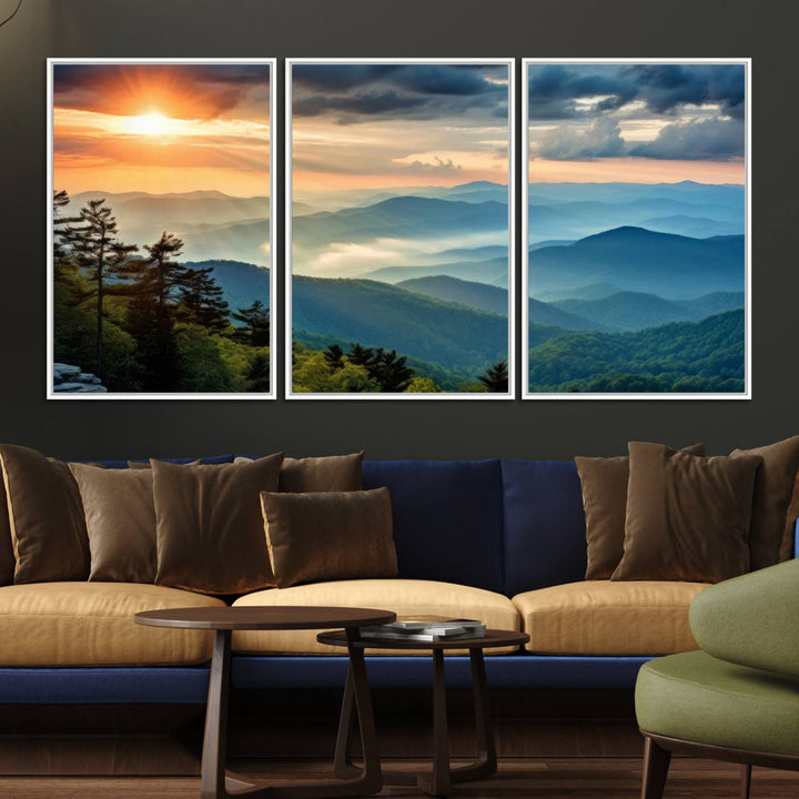 The wall art, titled Sunrise Over Mountain Range, is a canvas print that beautifully depicts layers of hills, scattered trees, and a partly cloudy sky.