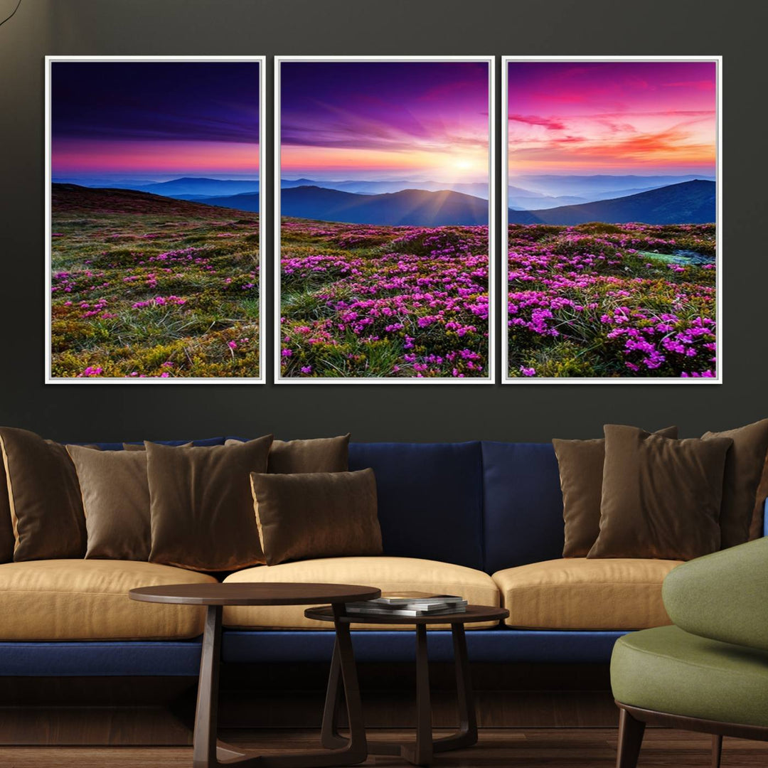 A 3-panel landscape photography canvas of a sunset over mountain meadows with purple wildflowers decorates the wall.