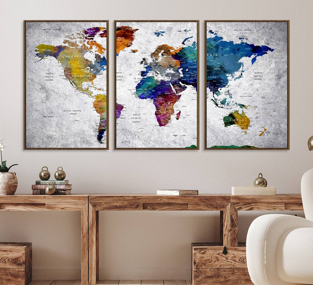 The World Map Art Canvas Print, featuring country names on a grunge-stained gray background, is perfect for stylish home decor.