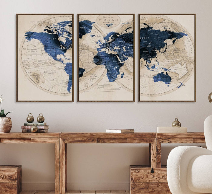The Vintage Triptych Map Print is a grunge-stained blue and beige world map, perfect for enhancing wall decor.