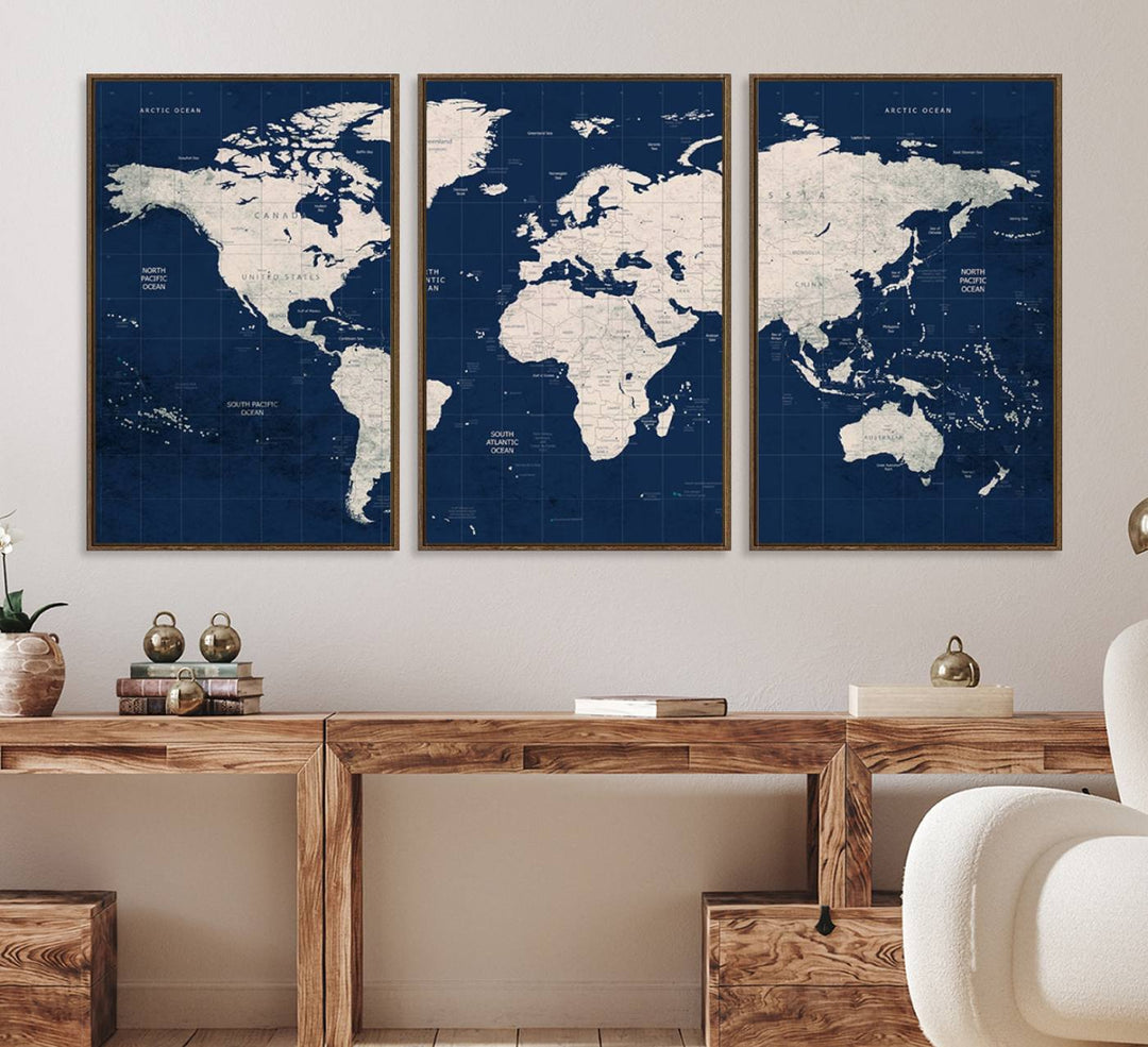 Large modern world map wall art canvas print in beige and navy; showcases a 3-panel vintage map design and is ready to hang.