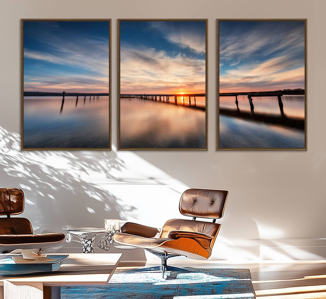 The Sunset Pier Canvas features a serene coastal landscape with vibrant hues under cloudy skies, ideal for modern decor.