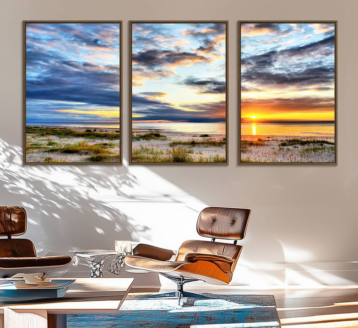 The Sunset On The Ocean canvas wall art features a beautiful beach sunset with grass and clouds.