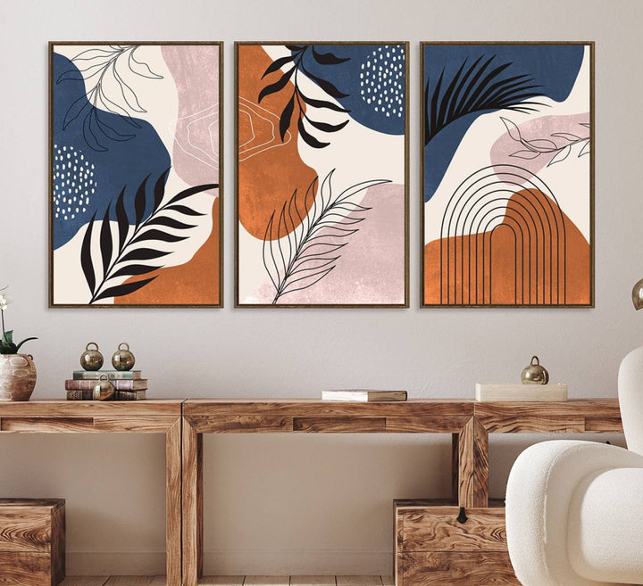 Boho Wall Art Canvas Print Set showcases mid-century geometric and leaf motifs in blue, ochre, and pink.