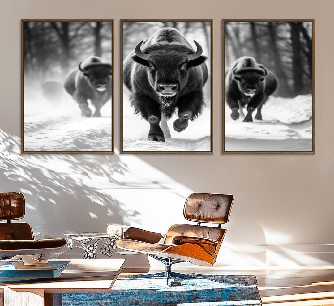 The Buffalo Wall Art Canvas Print of bison running through snow adorns the wall.