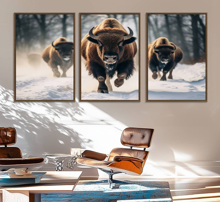 Wall art titled Cow Bighorn shows three bison running through snow in a forest.