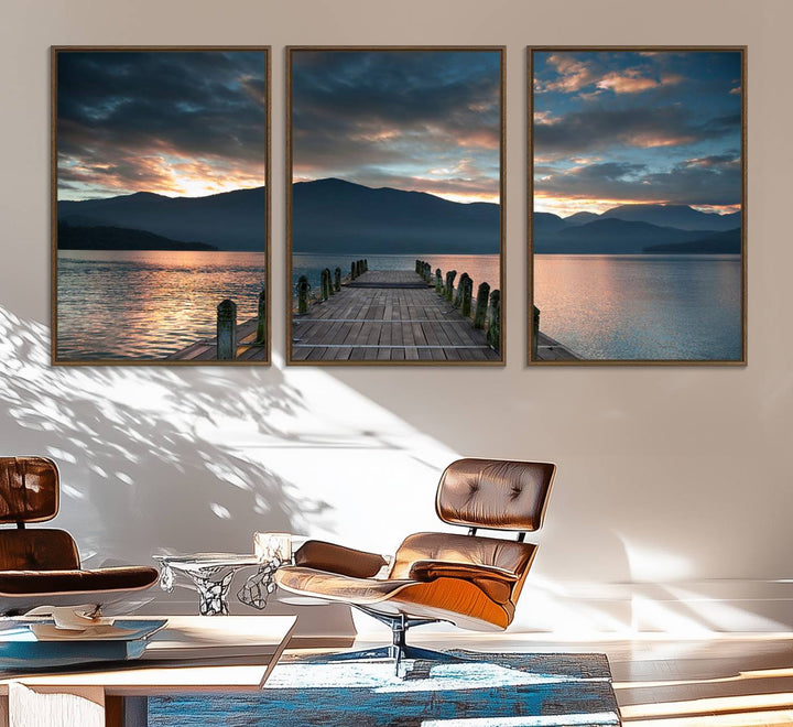 The Mountain Lake Wood Pier Canvas Wall Art depicts a serene lake and mountains, enhancing the beauty of any space.