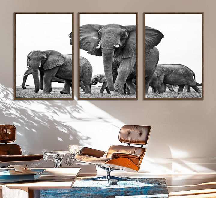 A modern dining area features a Black White Elephant Family Wall Art Canvas Print.