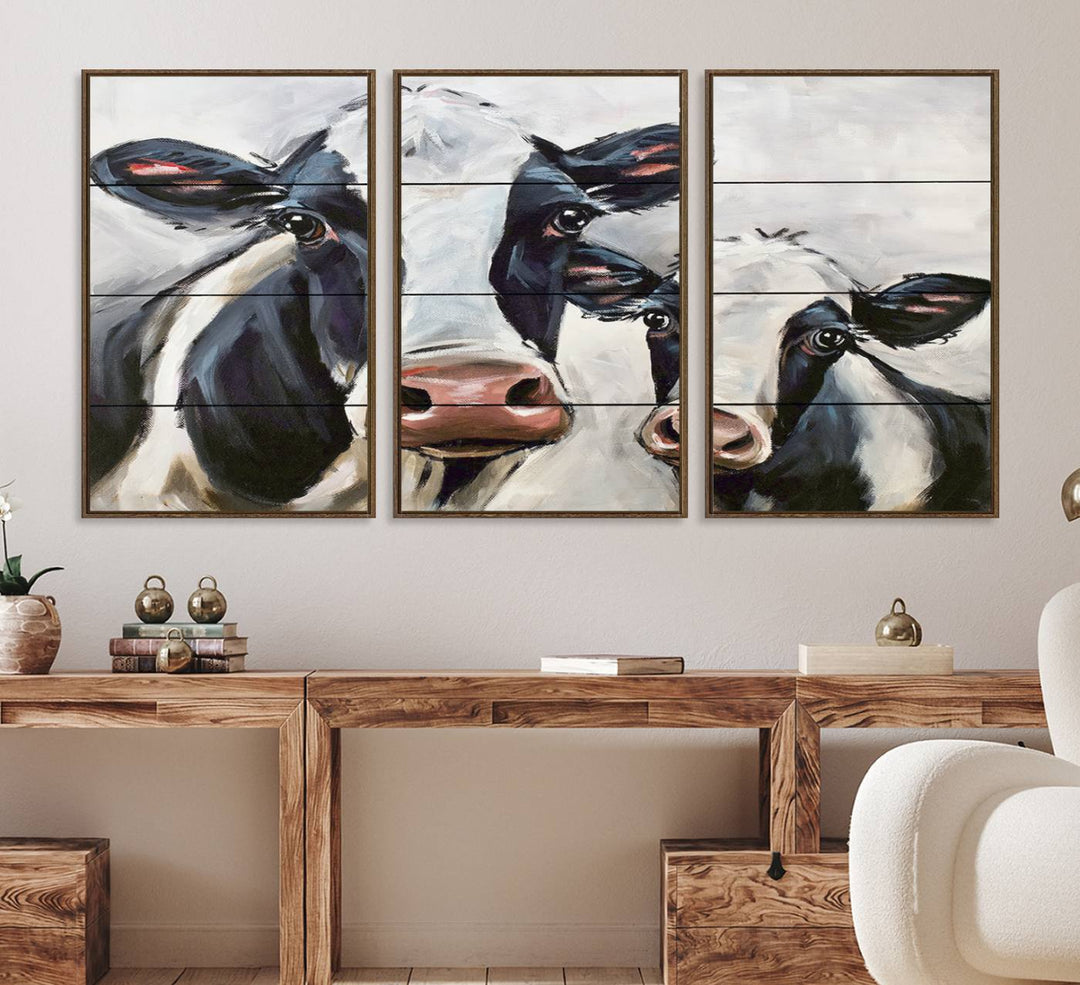 The Vintage Baby and Mom Cattle Canvas, featuring cows with black and white patches, is a prominent piece of wall art.