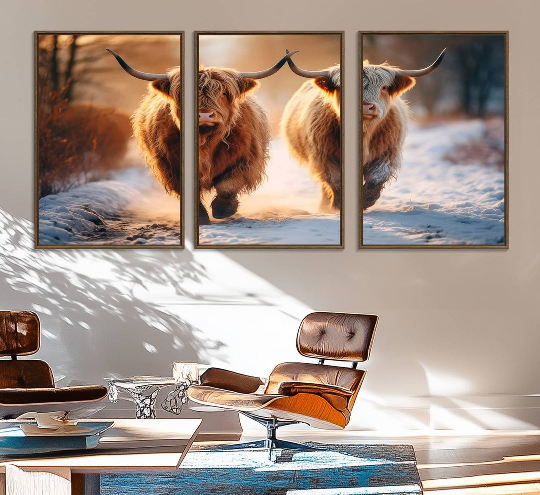 The wall art is a Scottish Highland Cow Horn canvas print featuring cows on a snowy path bathed in warm sunlight, serving as a rustic decor piece.