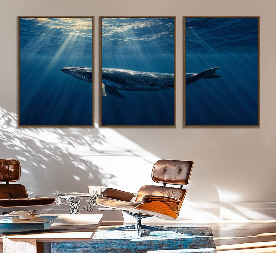 The Whale under Ocean wall art canvas print graces the white wall.