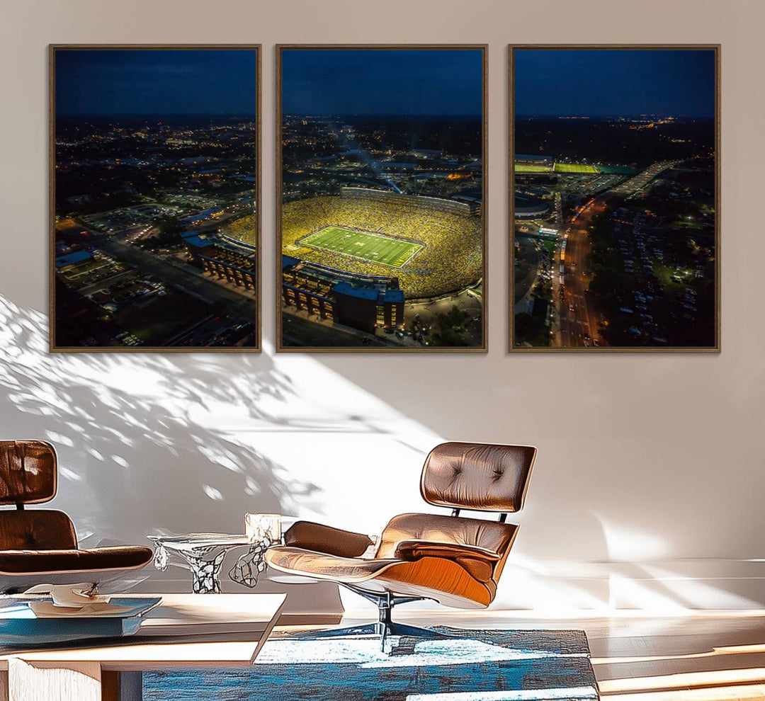 Aerial view of Michigan Stadium at night, surrounded by city lights, depicted on a Michigan Wolverines wall art canvas print.