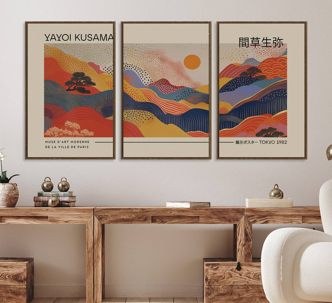 The Yayoi Kusama vibrant landscape canvas print featuring abstract mountains and a sun enhances the space with its modern aesthetic.