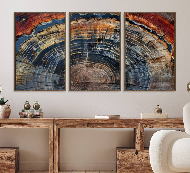 The Abstract Tree Ring Wall Art in orange, blue, and gray perfectly complements minimalist nature-inspired home decor.