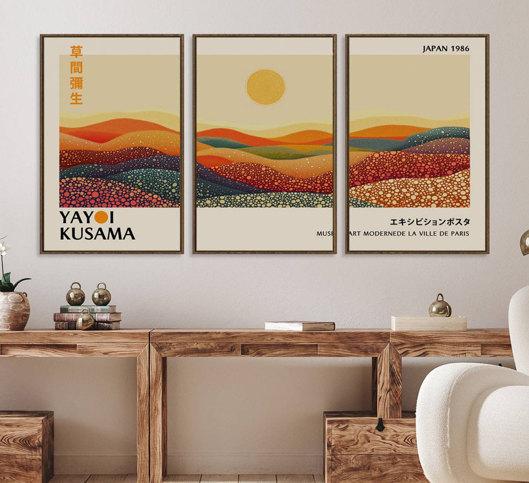 A Yayoi Kusama Wabi Sabi wall art print features abstract hills and a sun.