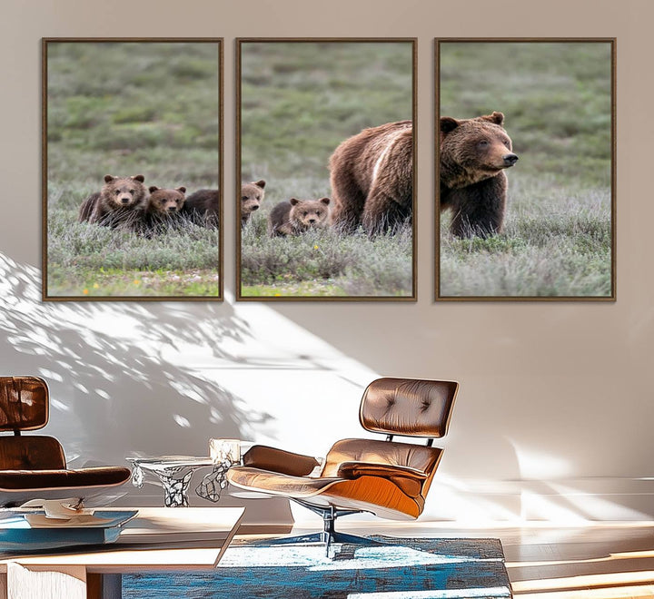 The large canvas print titled "Queen of the Tetons, 399 Grizzly Bear Cubs" showcases majestic wildlife photography of a bear and her cubs walking through the grass. This stunning canvas wall art, handmade in the USA, adds a charming touch to any room with its rustic decor appeal.