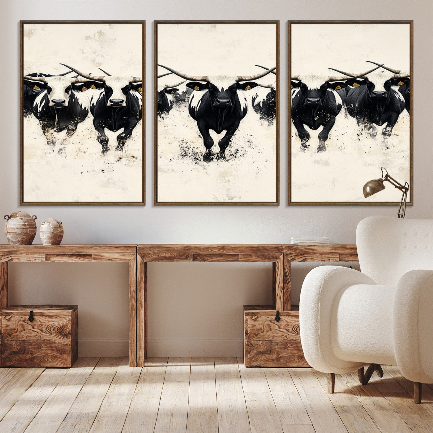 Canvas artwork of black and white Texas longhorns in a bold stampede over a minimalist background, ideal for rustic modern or Western-themed decor.