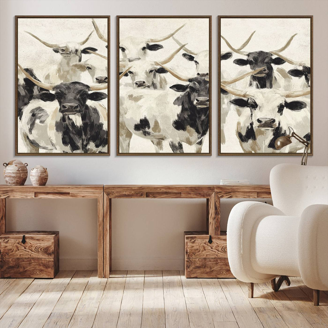 Canvas print titled Longhorn Texas Cow Drawing, depicting longhorn cattle with black and white markings, made in the USA, displayed on the wall.