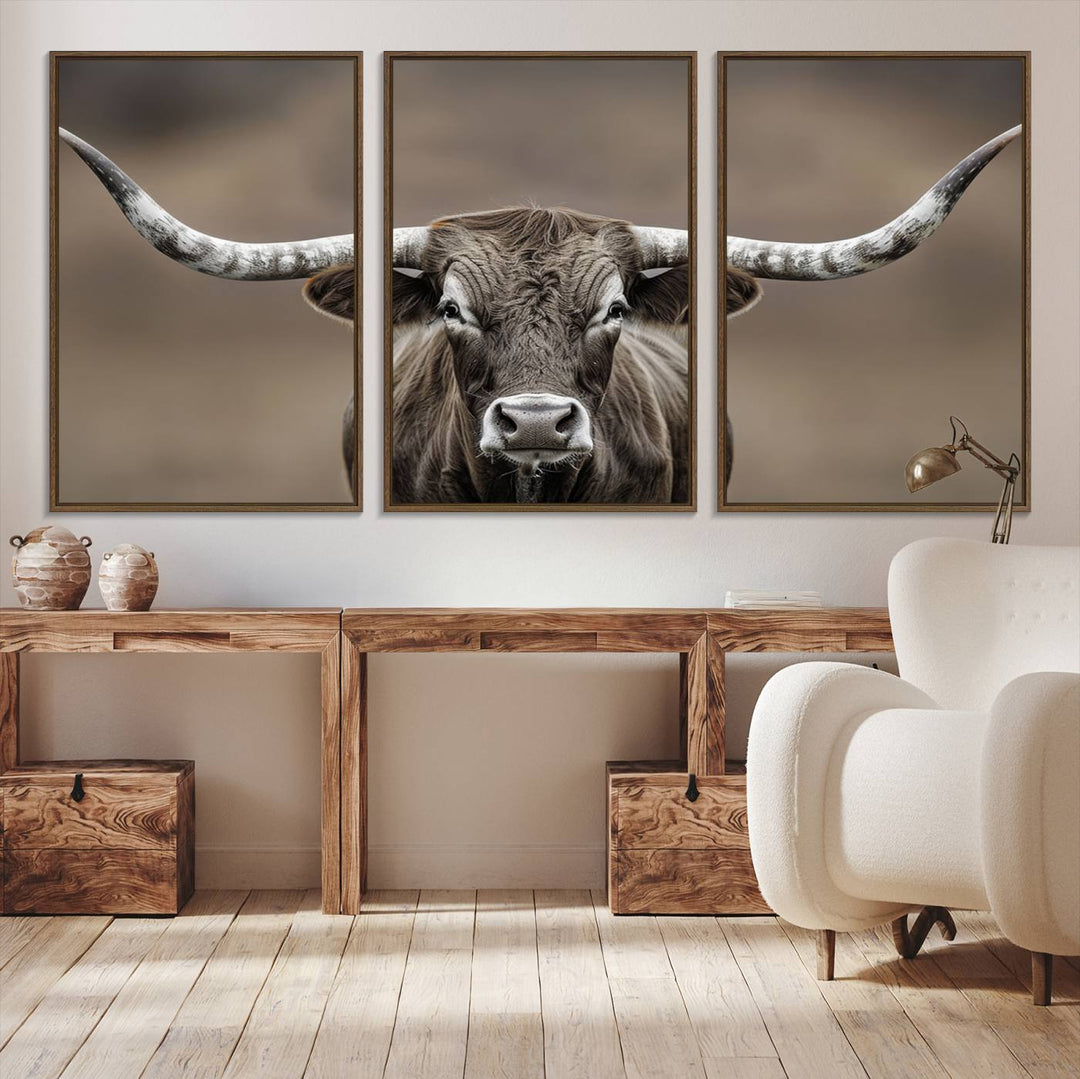 A close-up of a longhorn bull facing forward is featured in the Framed Texas Test-1, set against a blurred brown background.