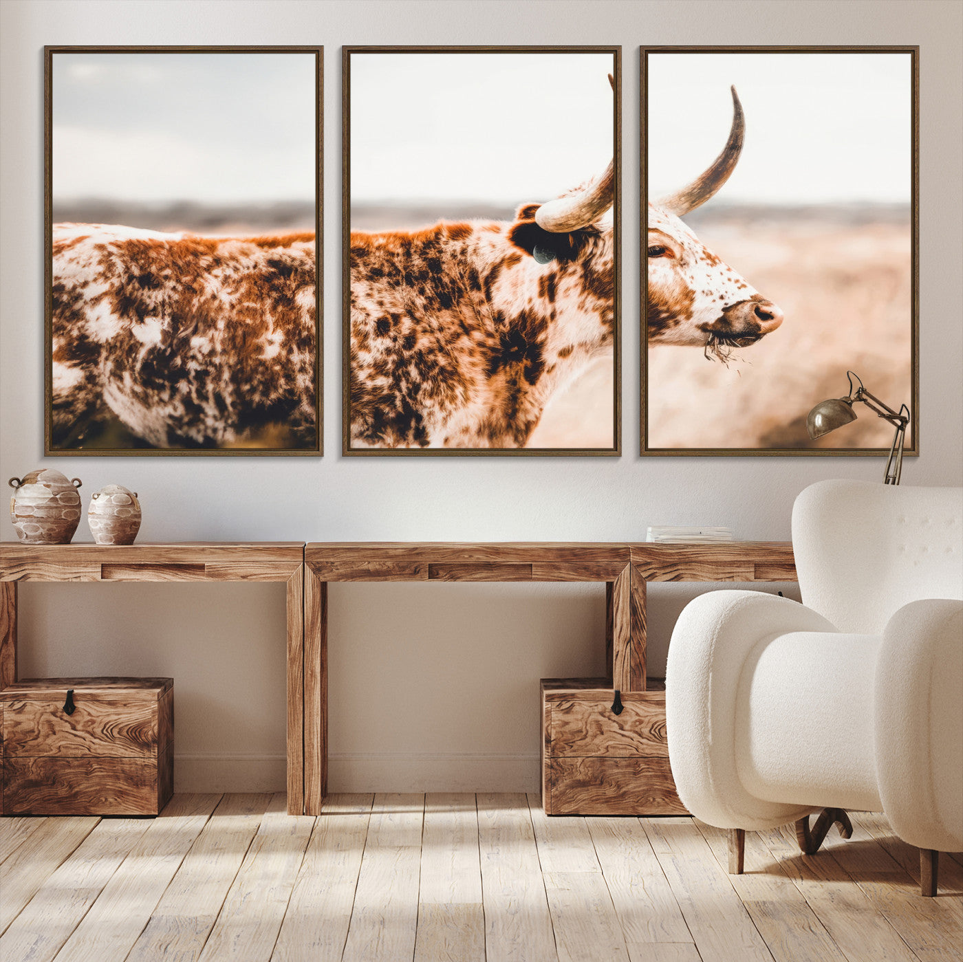 Speckled Texas longhorn with curved horns standing in a warm-toned prairie, perfect for rustic or country-style home decor.