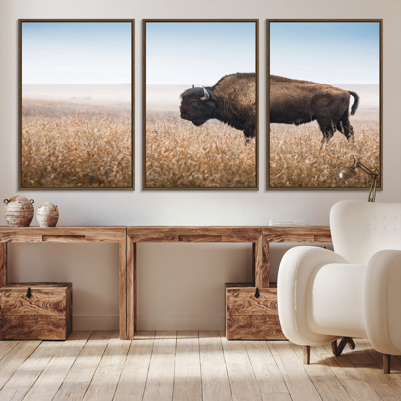 A solitary American bison stands in a dry grassland under soft skies, ideal for rustic or western-style home decor in warm neutral tones.