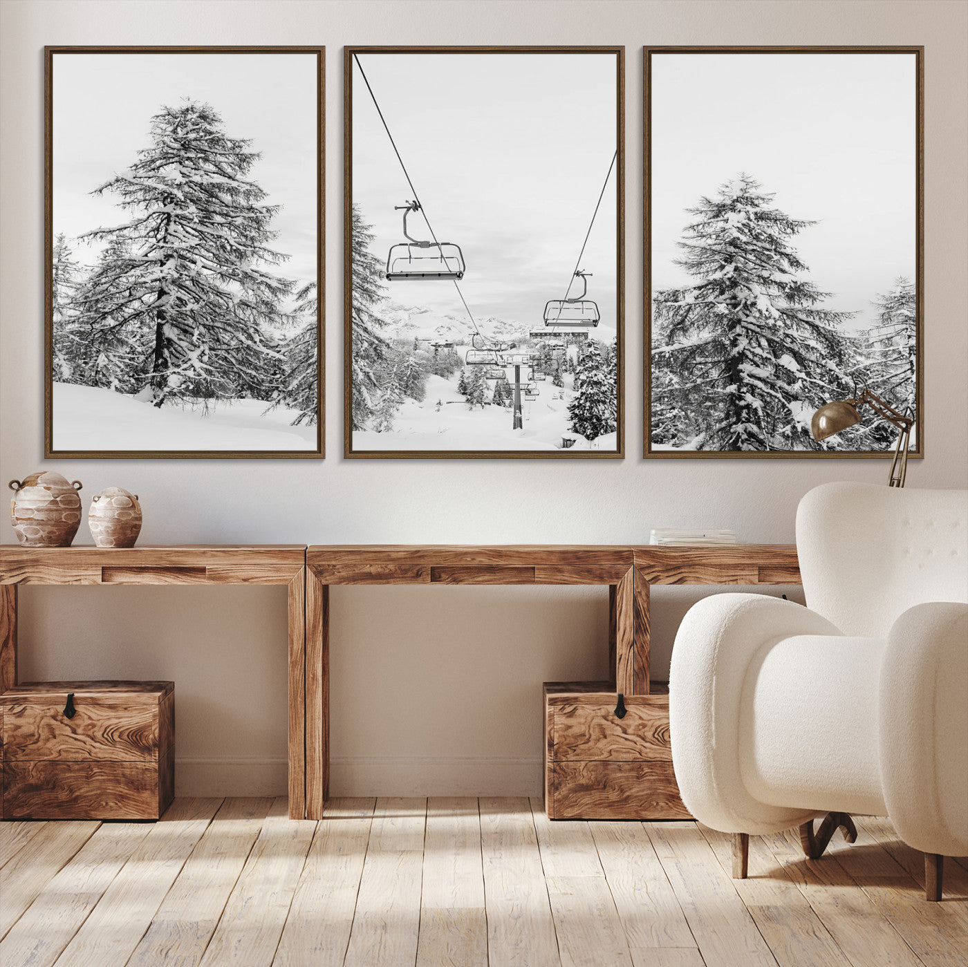 Black and white image of a ski lift amidst snow-covered pine trees, ideal for winter mountain or cabin-themed decor.