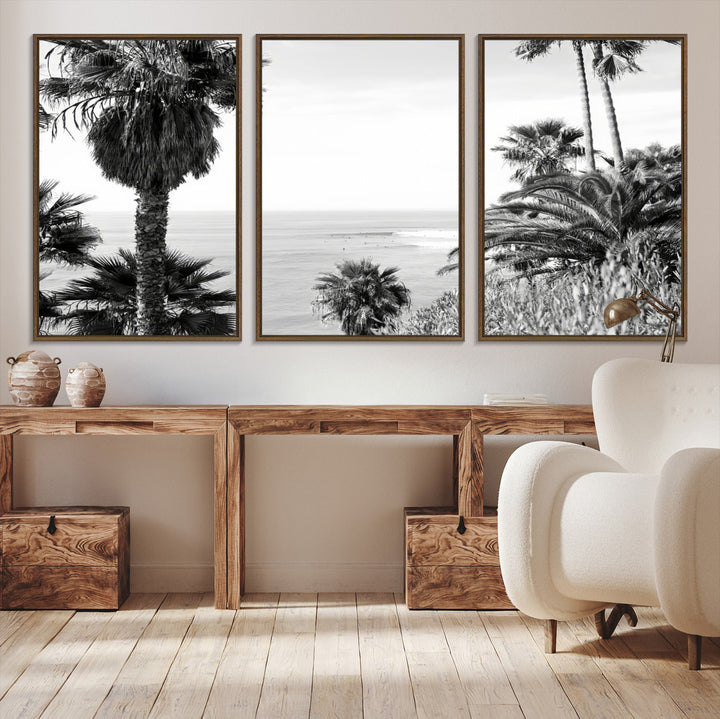 Monochrome canvas of palm trees framing a coastal surf scene, perfect for California-inspired or retro black-and-white beach decor.