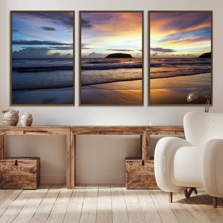 A tropical beach at sunset with waves gently washing ashore, reflecting golden and purple hues in the sky, creating a tranquil coastal scene.