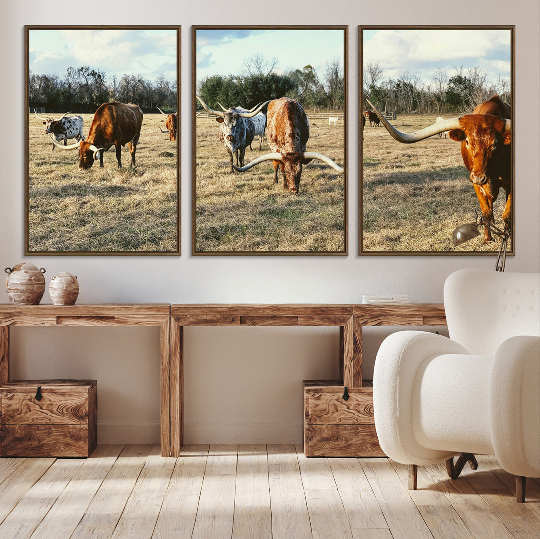 A herd of Texas Longhorn cattle grazing in an open field under a partly cloudy sky, capturing a rustic and Western ranch aesthetic.