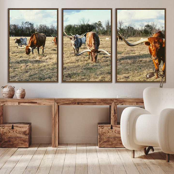 A herd of Texas Longhorn cattle grazing in an open field under a partly cloudy sky, capturing a rustic and Western ranch aesthetic.