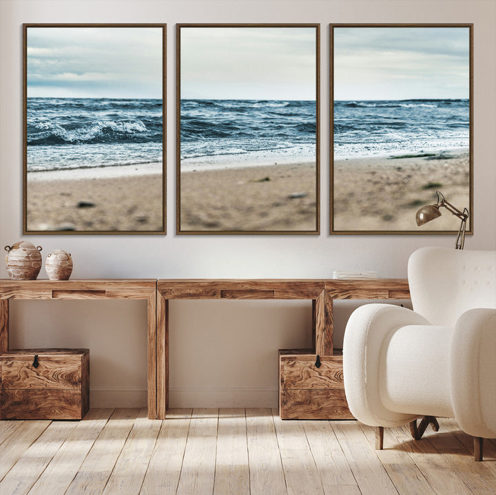 A moody ocean scene with gentle waves washing onto a sandy beach under a cloudy sky, creating a peaceful and coastal atmosphere.