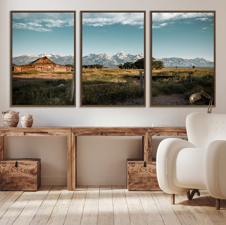 A rustic farmhouse with a wooden barn set against majestic mountain peaks under a soft blue sky, evoking peaceful countryside charm.