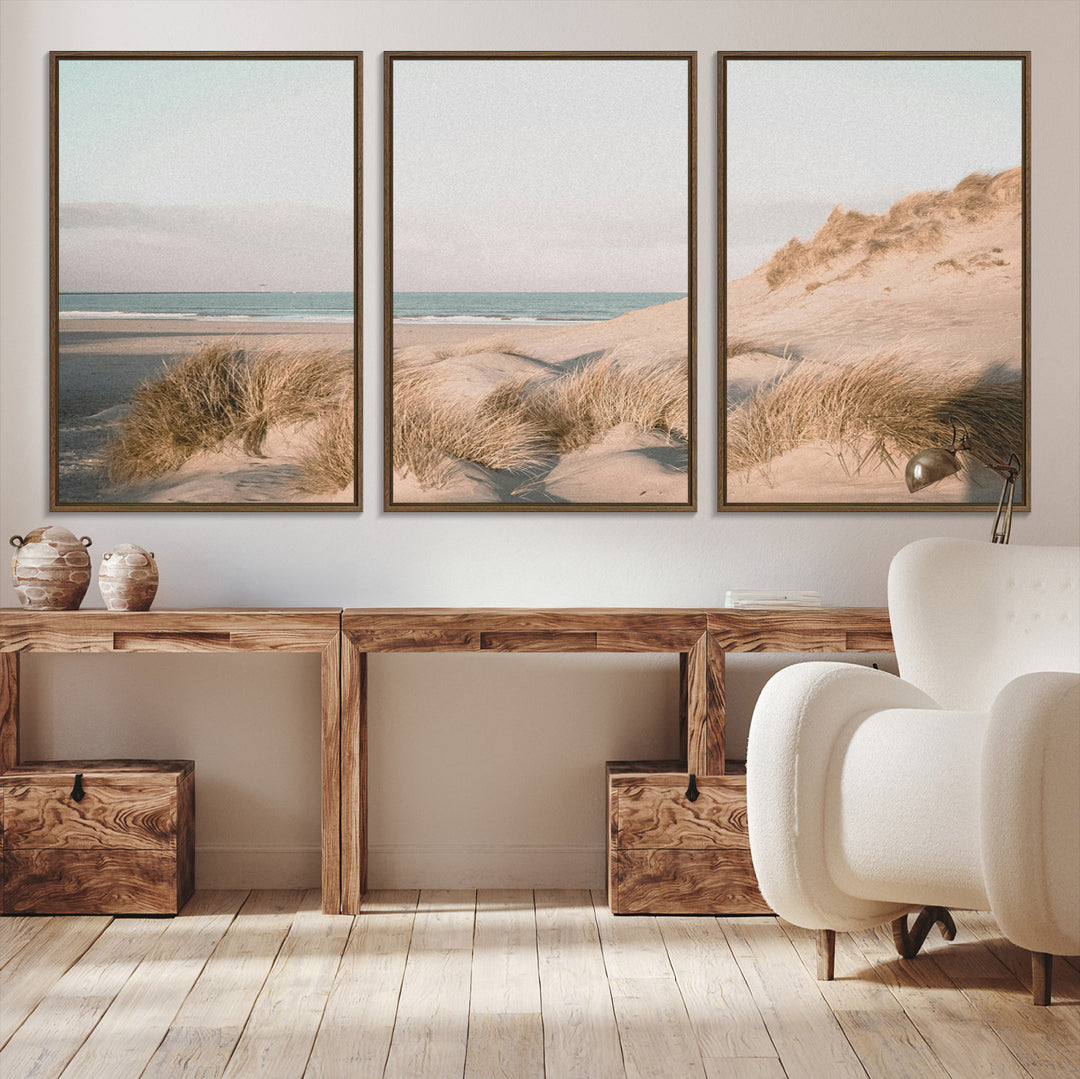 Soft pastel-toned beach scene with sand dunes, windswept grasses, and a calm ocean horizon, creating a serene coastal atmosphere.